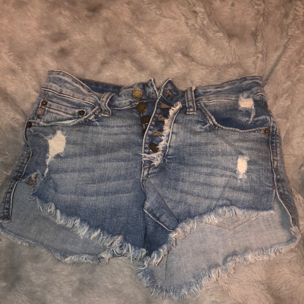 Size xs jean shorts with multiple buttons. Not very stretchy.